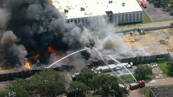 Houston firefighters battled a three-alarm blaze that erupted Friday at a warehouse that houses a cosmetics suppliers. Houston firefighters battled a three-alarm blaze that erupted Friday at a warehouse that houses a cosmetics suppliers.