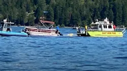 An East Side Fire District boat and other authorities search Lake Coeur d’Alene in north Idaho after two airplanes sank i the waters following a mid-air collision Sunday.