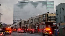 Firefighters work to put out a large commercial fire in downtown Los Angeles that injured 12 firefighters and left multiple buildings ablaze May 16. Firefighters work to put out a large commercial fire in downtown Los Angeles that injured 12 firefighters and left multiple buildings ablaze May 16.