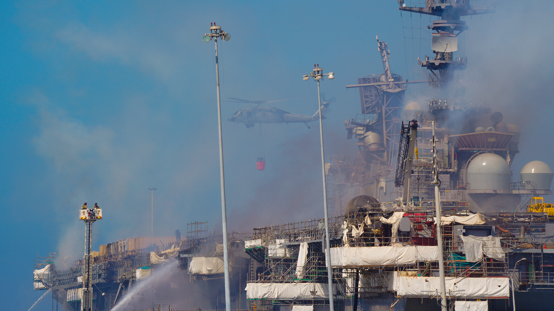 The Navy used helicopters for water drops over the fire that burned aboard Bonhomme Richard at San Diego Naval Base.