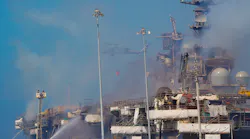 The Navy used helicopters for water drops over the fire that burned aboard Bonhomme Richard at San Diego Naval Base.