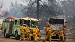 Firefighters await orders at a lot in Paradise, CA, on Nov. 17, 2018.