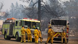 Firefighters await orders at a lot in Paradise, CA, on Nov. 17, 2018. Firefighters await orders at a lot in Paradise, CA, on Nov. 17, 2018.