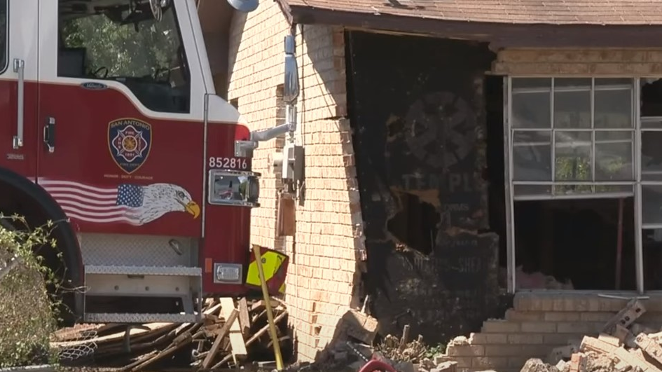 A San Antonio fire apparatus with no one inside rolled down a street and eventually crashed into a house Sunday.