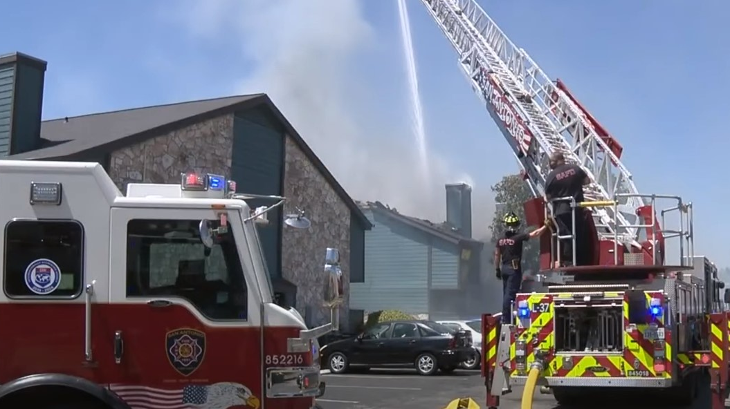 San Antonio, TX, firefighters battled record temperatures reaching 106 degrees while also battling an apartment complex blaze that destroyed 18 units Monday.