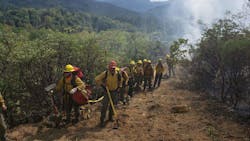 Oregon Department of Forestry firefighters finish mopping up the Shangrila Lane Fire near Rogue River on Tuesday. Oregon Department of Forestry firefighters finish mopping up the Shangrila Lane Fire near Rogue River on Tuesday.
