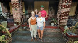 Faith and Shelby, NC, Fire Chief William Hunt stand outside their damaged home with daughters Grace (left) and Cana on Wednesday. The Hunt home was one of multiple fires believed to be arson this month. Faith and Shelby, NC, Fire Chief William Hunt stand outside their damaged home with daughters Grace (left) and Cana on Wednesday. The Hunt home was one of multiple fires believed to be arson this month.