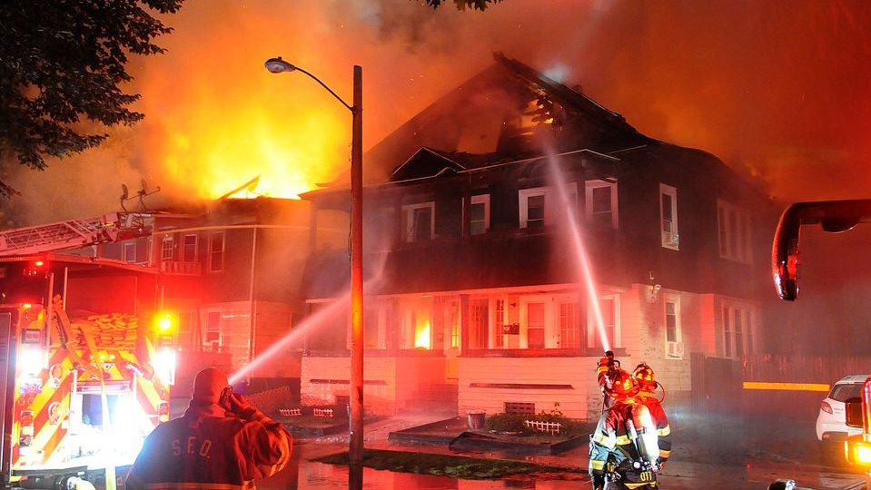 A Springfield, MA, firefighter was injured while battling a three-alarm blaze that tore through two multi-family homes late Friday.