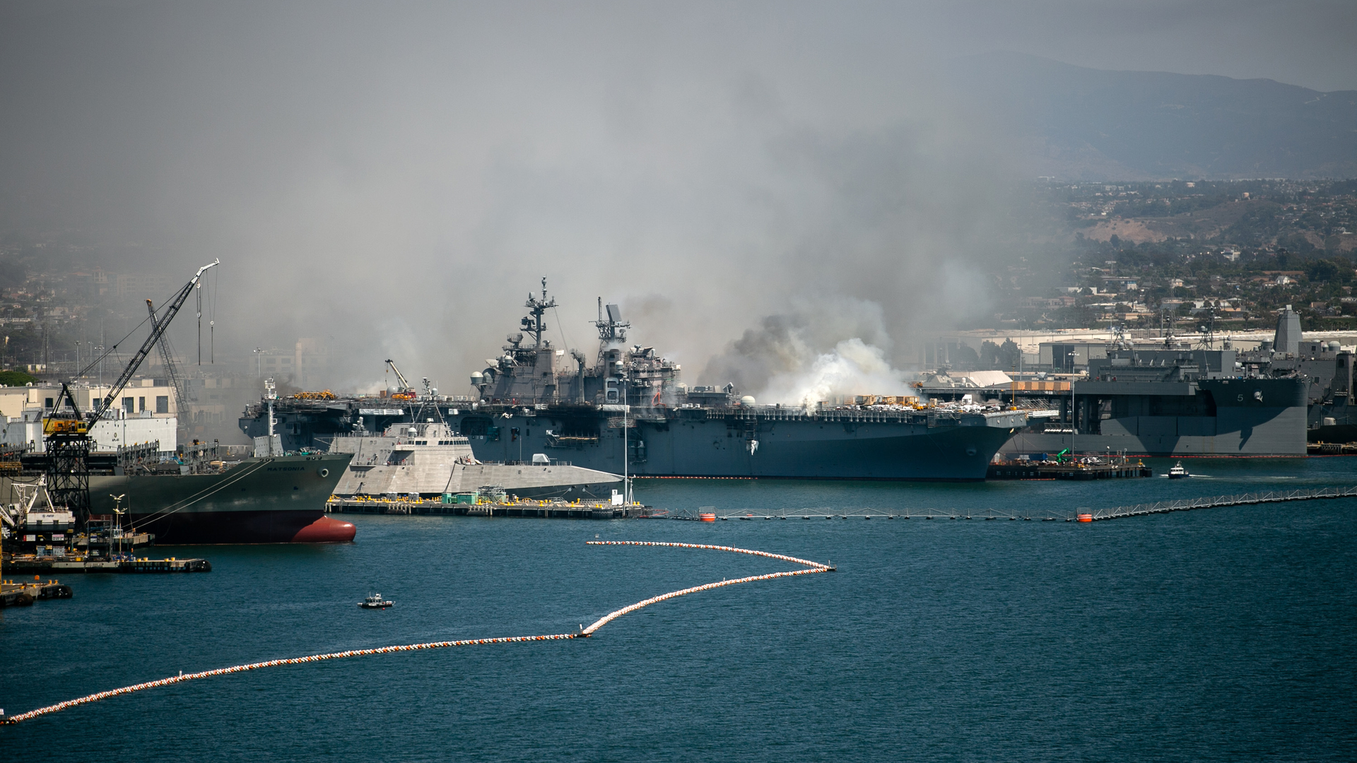 Fire rages aboard the USS Bonhomme Richard on Sunday, July 12, 2020, at Naval Base San Diego.