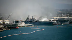 Fire rages aboard the USS Bonhomme Richard on Sunday, July 12, 2020, at Naval Base San Diego.