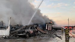 Two firefighters were pinned when a cinder block wall collapsed. Two firefighters were pinned when a cinder block wall collapsed.