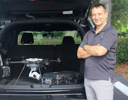 Dean Attridge, vice president of STRAX Intelligence Group's Field Operations with the PoDD and a drone. Dean Attridge, vice president of STRAX Intelligence Group's Field Operations with the PoDD and a drone.