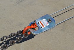 Figure 1. This running, or traveling, snatch block, which is attached directly to the load via a chain, is being used in a 2:1 mechanical advantage system. The pulling effort from the winch comes in on one side, makes a U-turn on the sheave/pulley of the snatch block and returns back to the winch vehicle—hence, two lines to the load. Figure 1. This running, or traveling, snatch block, which is attached directly to the load via a chain, is being used in a 2:1 mechanical advantage system. The pulling effort from the winch comes in on one side, makes a U-turn on the sheave/pulley of the snatch block and returns back to the winch vehicle—hence, two lines to the load.