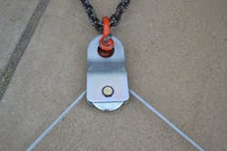 Figure 2. The same snatch block as shown in Figure 1, which now is secured to an anchor point, now is a fixed block (read: rigged for a change of direction). There is no mechanical advantage here. The pulling effort comes in on one side and goes out of the other side of the block, which forms an 85-degree angle. The stress factor on the snatch block is 1.41 times the load. For example, if the load that’s being pulled is 6,000 lbs., the load on the snatch block would be almost 9,000 lbs. Figure 2. The same snatch block as shown in Figure 1, which now is secured to an anchor point, now is a fixed block (read: rigged for a change of direction). There is no mechanical advantage here. The pulling effort comes in on one side and goes out of the other side of the block, which forms an 85-degree angle. The stress factor on the snatch block is 1.41 times the load. For example, if the load that’s being pulled is 6,000 lbs., the load on the snatch block would be almost 9,000 lbs.