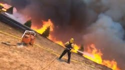 A fireground photographer captured dramatic video footage of firefighters battling the Apple Fire, which has torn through Riverside and San Bernardino counties.