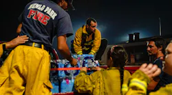 Supplies are unloaded from a Menlo Park, CA, vehicle at the Boulder Creek Volunteer Fire Department station Friday during the CZU Lightning Complex fires.