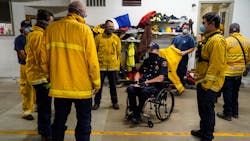 Menlo Park, CA, Fire Chief Harold Schapelhouman (center) talks with volunteers at the Boulder Creek Fire District, during the CZU Lightning Complex Fires on Friday. Menlo Park, CA, Fire Chief Harold Schapelhouman (center) talks with volunteers at the Boulder Creek Fire District, during the CZU Lightning Complex Fires on Friday.