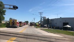 Two firefighters were injured battling a large commercial at a Chilton, WI, manufacturing facility Wednesday.