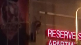 Cleveland firefighters rescued an injured skydiver who became entangled on top of a downtown parking garage early Sunday.