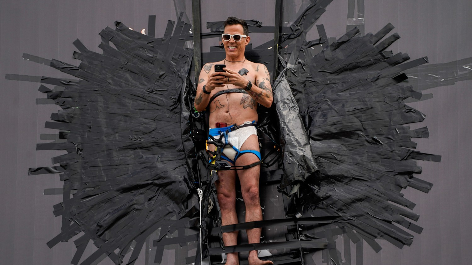Actor Steve-O is pictured taped to a Hollywood billboard sign on Thursday, Aug. 13, 2020, in Los Angeles.
