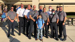 Easton Dodd, son of firefighter Kyle Dodd, who died unexpectedly last month, was escorted to school Tuesday by firefighters from Oneonta, AL, Fire and Rescue Service and Center Point Fire District.