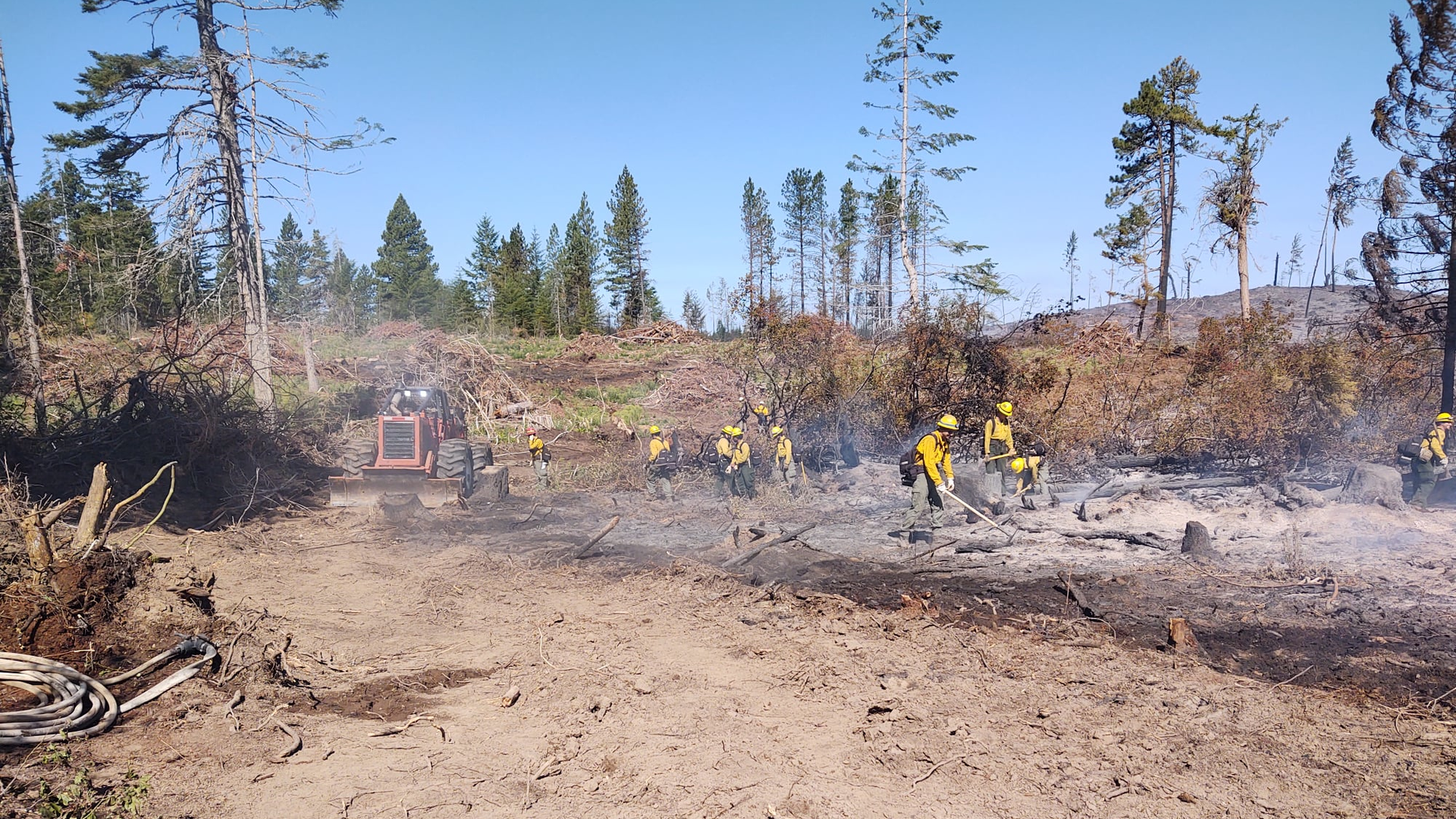 Firefighters work to contain the Fir Mountain Fire in Oregon's Columbia River Gorge.