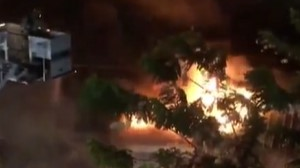 A Honolulu firefighter suffered a serious leg injury battling a massive auto repair shop blaze Thursday.