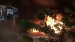 A Honolulu firefighter suffered a serious leg injury battling a massive auto repair shop blaze Thursday.