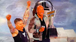 North Metro, CO, Fire Rescue District firefighter Matt Chan celebrates with 'Titan Games' host Dwayne 'The Rock' Johnson after becoming champion this season during Monday's show.