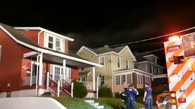 Firefighters rescued a woman who ran back into a burning house for her pets in New Castle early Wednesday.