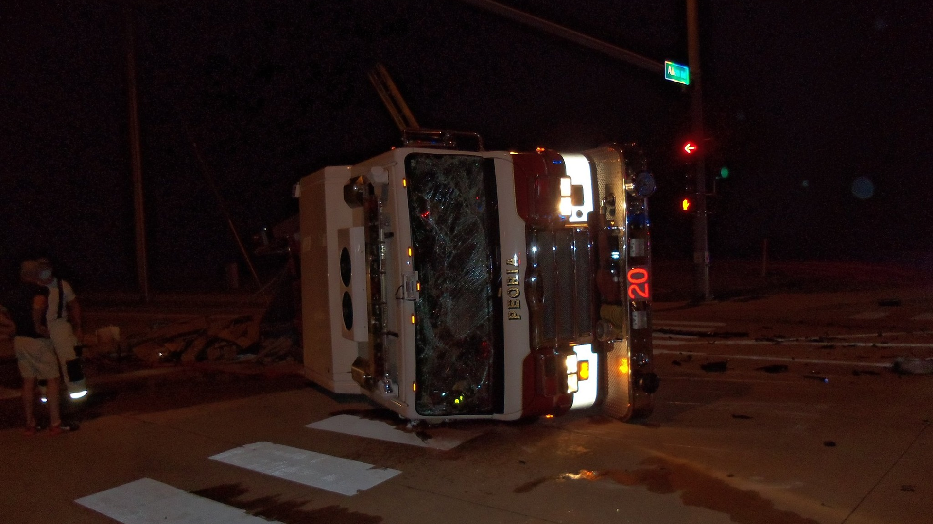 A Peoria, IL, fire apparatus was spun 180 degrees and flipped on its side after the vehicle was struck by a suspected drunken driver early Friday.