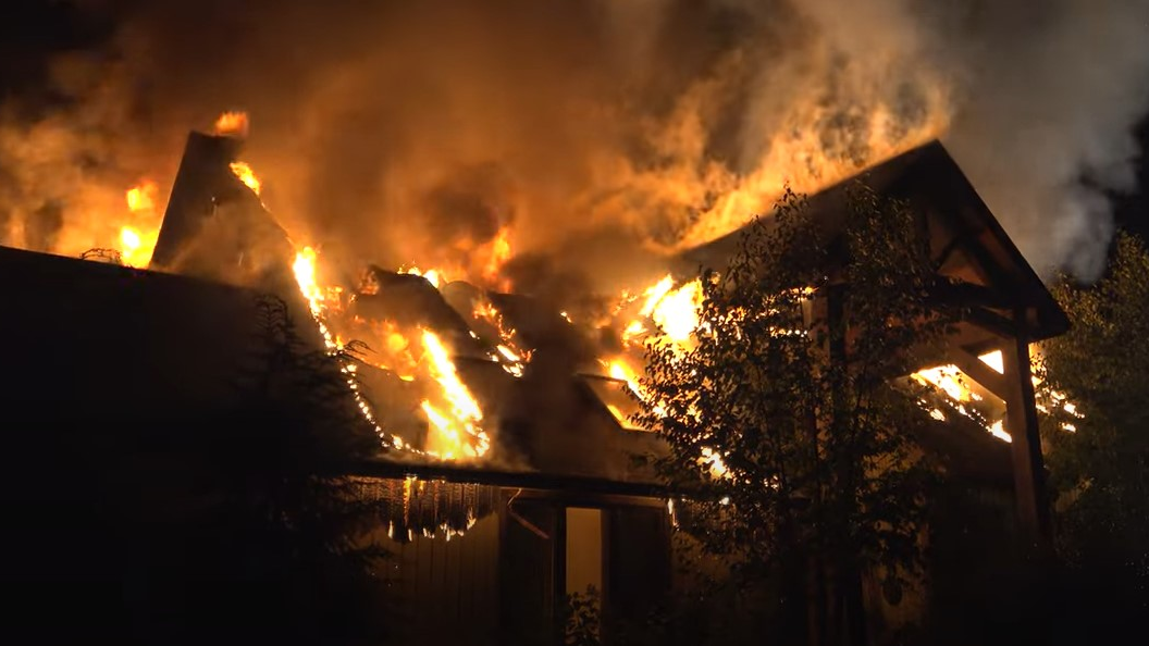Firefighters from multiple departments battled a massive blaze that broke out at the Lake Luzerne, NY, seasonal house of TV celebrity chef Rachael Ray on Sunday.