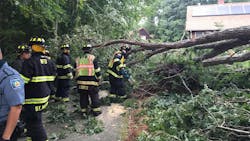 Rehoboth, MA, firefighters rescued a man who was trapped under tree that was knocked down by Tropical Storm Isaias on Tuesday. Rehoboth, MA, firefighters rescued a man who was trapped under tree that was knocked down by Tropical Storm Isaias on Tuesday.