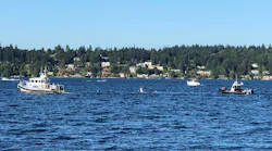 Seattle Fire Department divers, rescue swimmers and response boats search Andrews Bay in Lake Washington on Aug. 9 for Terrence L. Christian Jr., who had struggled swimming in the water. His body eventually was recovered on Aug. 14.