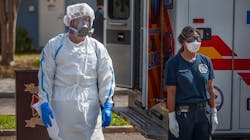 Firefighter/Paramedic William Fletcher (left) wears COVID-19 personal protective equipment and EMT Mya Jones wears basic level personal protective equipment during a press conference March 31 in the parking lot of Northwest Community Pool in St. Petersburg, FL. St. Petersburg Fire Rescue, in partnership with Sunstar Paramedics, has developed a strategy to deploy COVID-19 Strike Teams. Firefighter/Paramedic William Fletcher (left) wears COVID-19 personal protective equipment and EMT Mya Jones wears basic level personal protective equipment during a press conference March 31 in the parking lot of Northwest Community Pool in St. Petersburg, FL. St. Petersburg Fire Rescue, in partnership with Sunstar Paramedics, has developed a strategy to deploy COVID-19 Strike Teams.