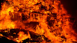 A structure burns along Riverdale Boulevard in Boulder Creek, CA, during the CZU Lightning Complex Fire on Aug. 23, 2020.