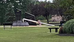 A severed flagpole rests on the ground at a 9/11 memorial in Washingtonville, NY, on July 9, 2020.
