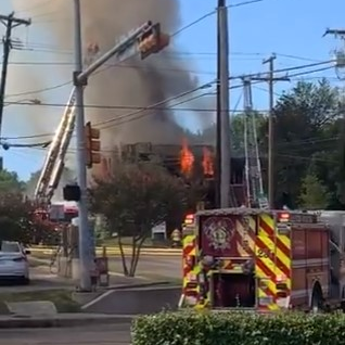 Dallas firefighters battled a three-alarm blaze that broke out at a vacant commercial building on the city's soutthwest side Sunday.