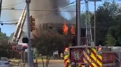Dallas firefighters battled a three-alarm blaze that broke out at a vacant commercial building on the city's soutthwest side Sunday.