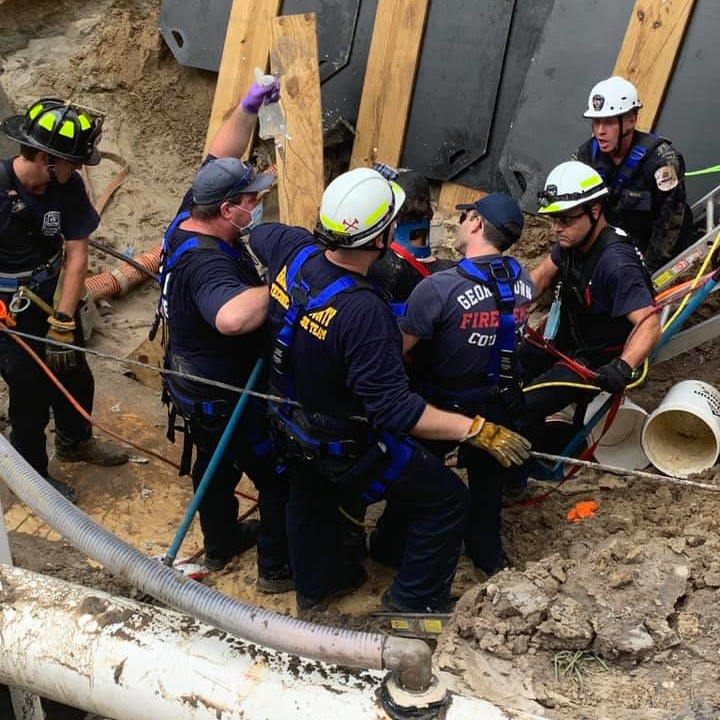 Midway, SC, Fire Rescue crews rescued a person who was buried shoulder-deep in a ditch in the Pawleys Island area Thursday.