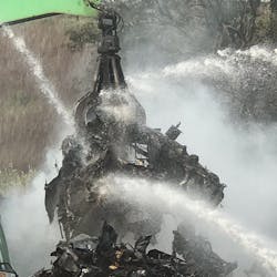 Firefighters battled piles of burning vehicles Thursday at a New Haven, CT, junkyard.