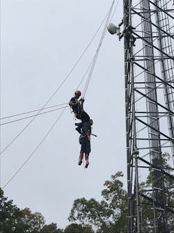 A student performs a ground-based rescue of a patient using a combined skate-block and guiding line, which is backed up with an ASAP lock. A student performs a ground-based rescue of a patient using a combined skate-block and guiding line, which is backed up with an ASAP lock.