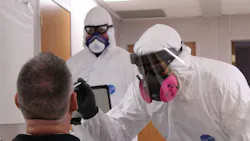 Allen, TX, firefighter and paramedic Tony Cooper (left) and Division Chief Daniel Williams administer a COVID-19 test in May 22. Allen, TX, firefighter and paramedic Tony Cooper (left) and Division Chief Daniel Williams administer a COVID-19 test in May 22.