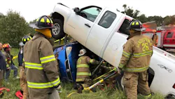 Firefighters from multiple departments rescued a person who was trapped in a vehicle that was pinned by a pickup truck in an accident in Anderson County, SC, on Friday.