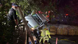 Austin, TX, firefighters rescued a woman who was trapped in her pickup truck between two retaining walls following a one-vehicle crash early Tuesday.