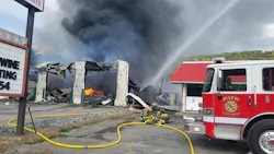 Firefighters from 16 departments faced fireballs from exploding oil barrels in a massive blaze that broke out at a Bath, NY, towing company Thursday. Firefighters from 16 departments faced fireballs from exploding oil barrels in a massive blaze that broke out at a Bath, NY, towing company Thursday.