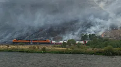 A specially equipped firefighting train from BNSF Railway helping to contain Washington's Evans Canyon Fire can take firefighters to hard-to-reach hot spots, carries 30,000 gallons of water and uses hoses to shoot water up to 30 feet away.