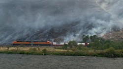 A specially equipped firefighting train from BNSF Railway helping to contain Washington's Evans Canyon Fire can take firefighters to hard-to-reach hot spots, carries 30,000 gallons of water and uses hoses to shoot water up to 30 feet away. A specially equipped firefighting train from BNSF Railway helping to contain Washington's Evans Canyon Fire can take firefighters to hard-to-reach hot spots, carries 30,000 gallons of water and uses hoses to shoot water up to 30 feet away.