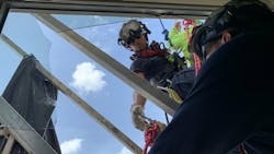 Houston firefighters rescued two window washers from a platform that broke outside a high-rise Wednesday. Houston firefighters rescued two window washers from a platform that broke outside a high-rise Wednesday.
