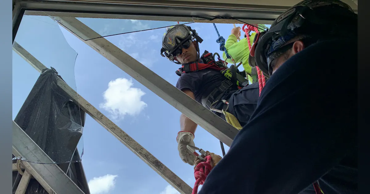 Photos: Houston Firefighters Rescue Window Washers | Firehouse